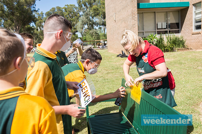 Students working on the 'buddy bench'. Photo: Megan Dunn