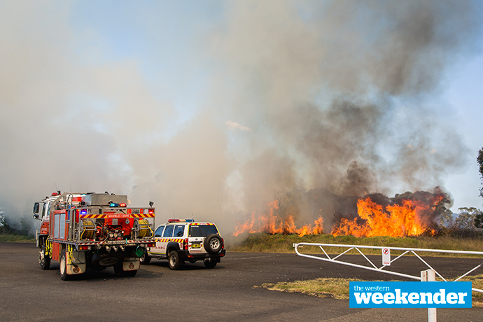 Fire crews work on last Friday's fire at Colyton. Photo: Megan Dunn