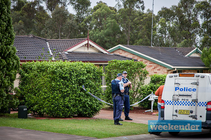 Police at the woman's home this morning. Photo: Megan Dunn