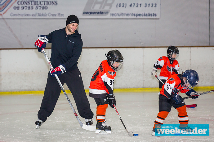 Nathan Walker with kids at the Ice Palace. Photo: Megan Dunn