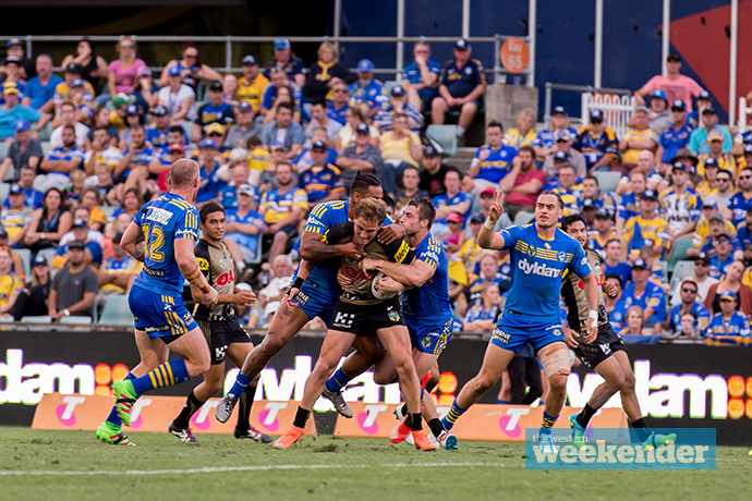 Matt Moylan tries to break through a tackle in his comeback game. Photo: Megan Dunn