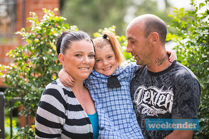 Taleigha-Rose with her mum Emma and dad Phil. Photo: Megan Dunn