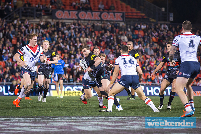 Trent Merrin in action against the Roosters. Photo: Megan Dunn