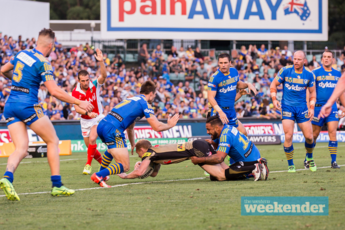 Wallace dives over against the Eels. Photo: Megan Dunn